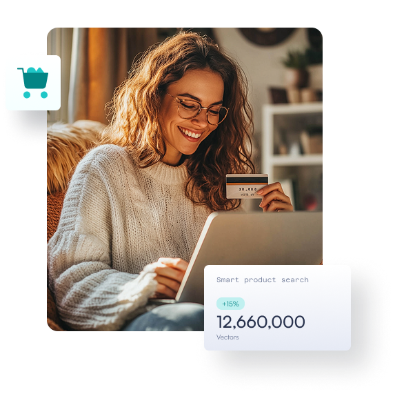 A smiling woman with a laptop and a bank card